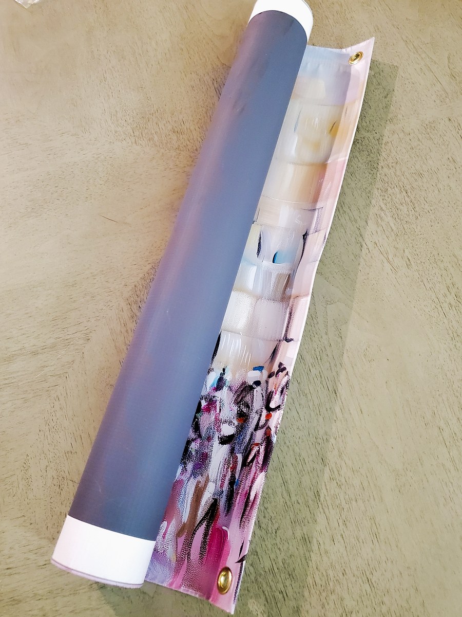 The poster rolled around a shipping tube